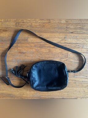ATELIER NOIR Leather Crossbody Bag with Tassel Accent